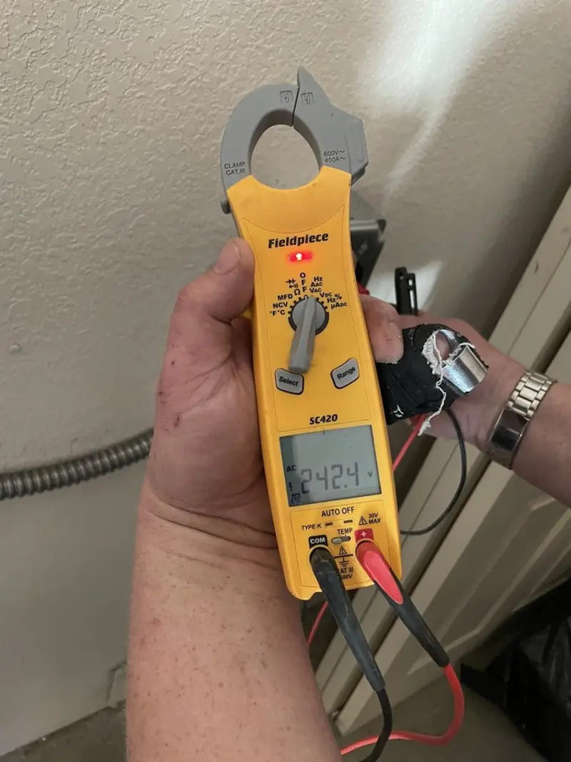 Voltage testing with clamp meter during Recessed Lighting Installation in Bowling Green